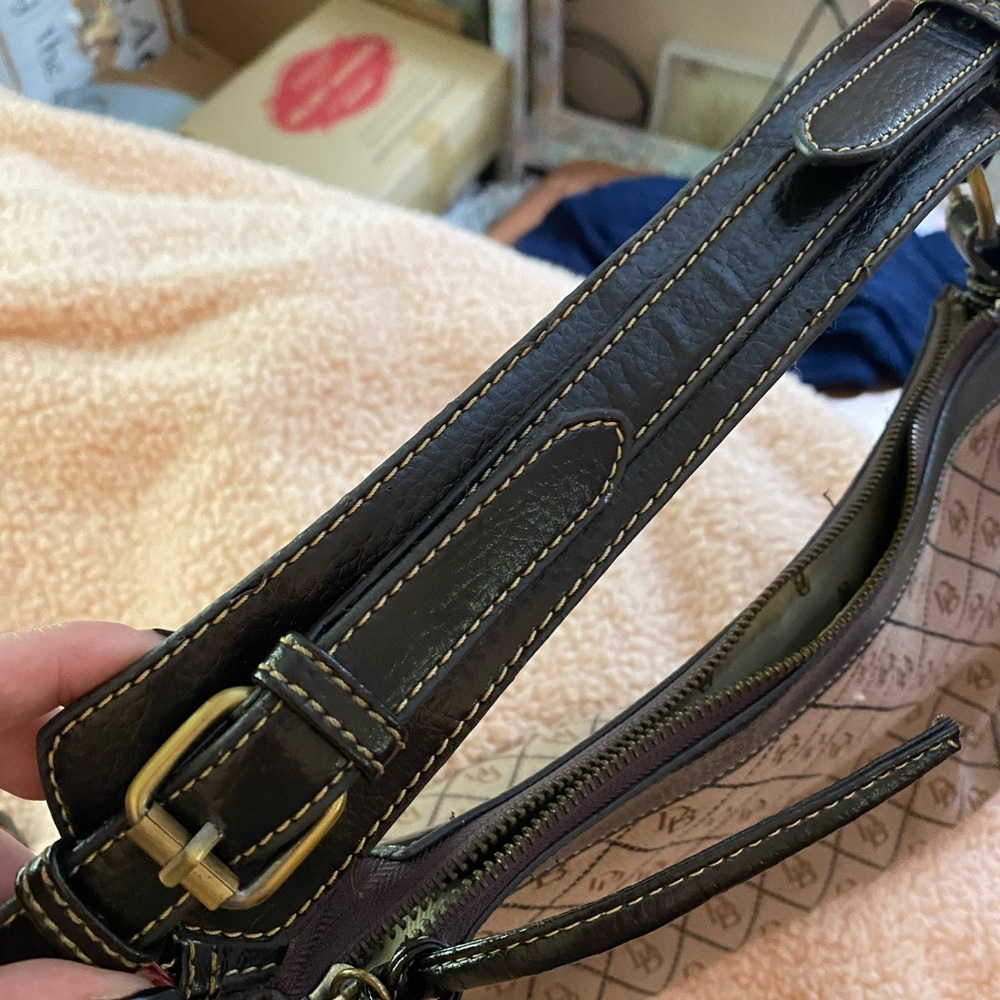 Dooney&Burke perfect condition. No wear or stains. Equestrian strap.